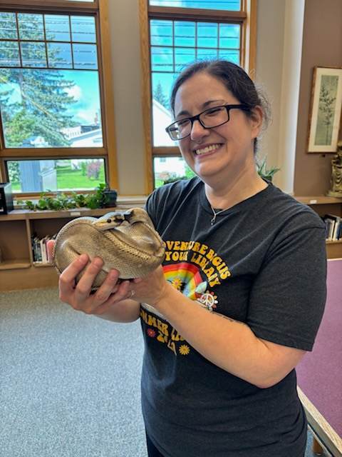 Krista holding snake headshot of Jill Daby