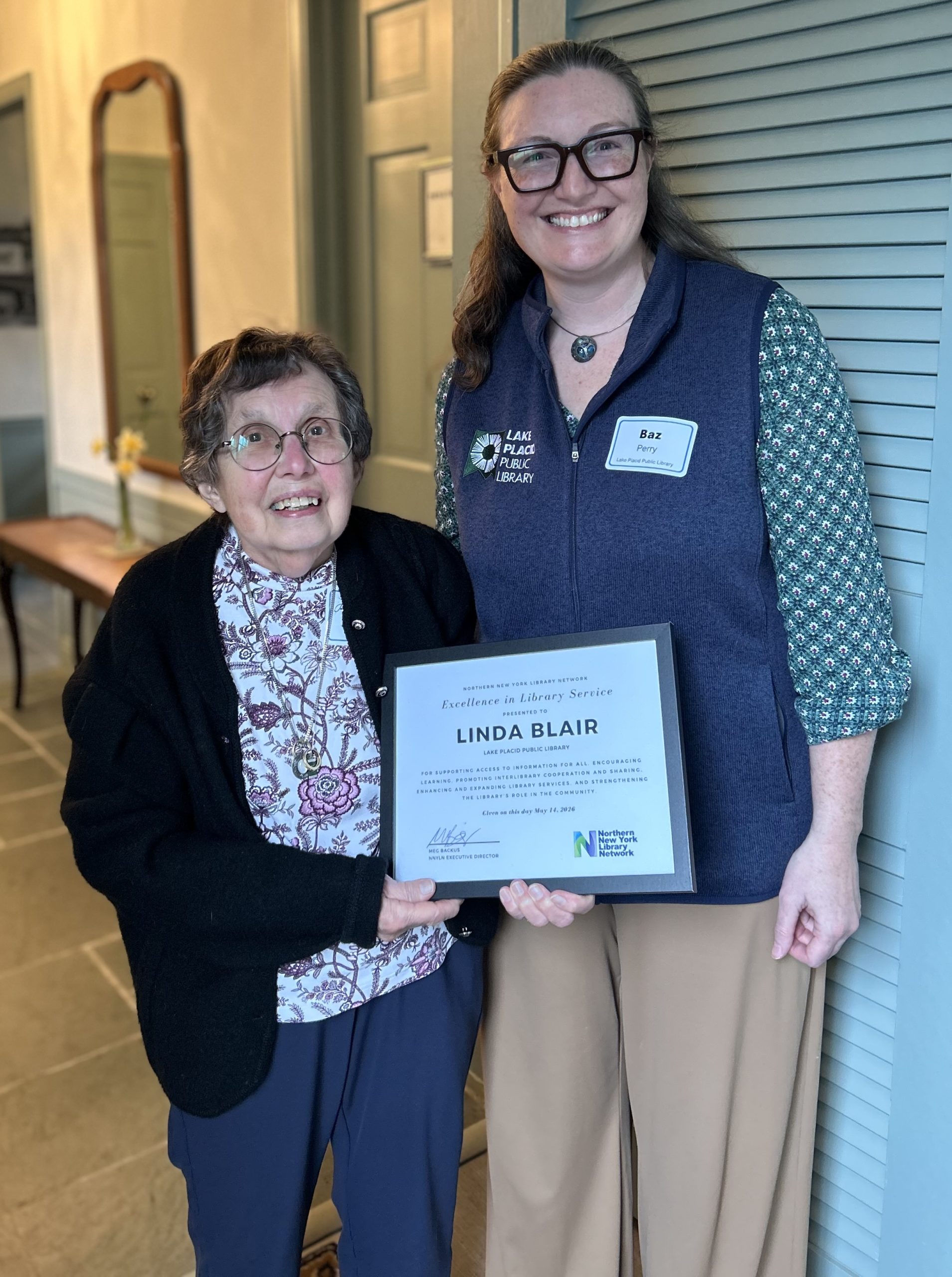 Award winner Linda Blair standing with Lake Placid Public library director Baz Perry