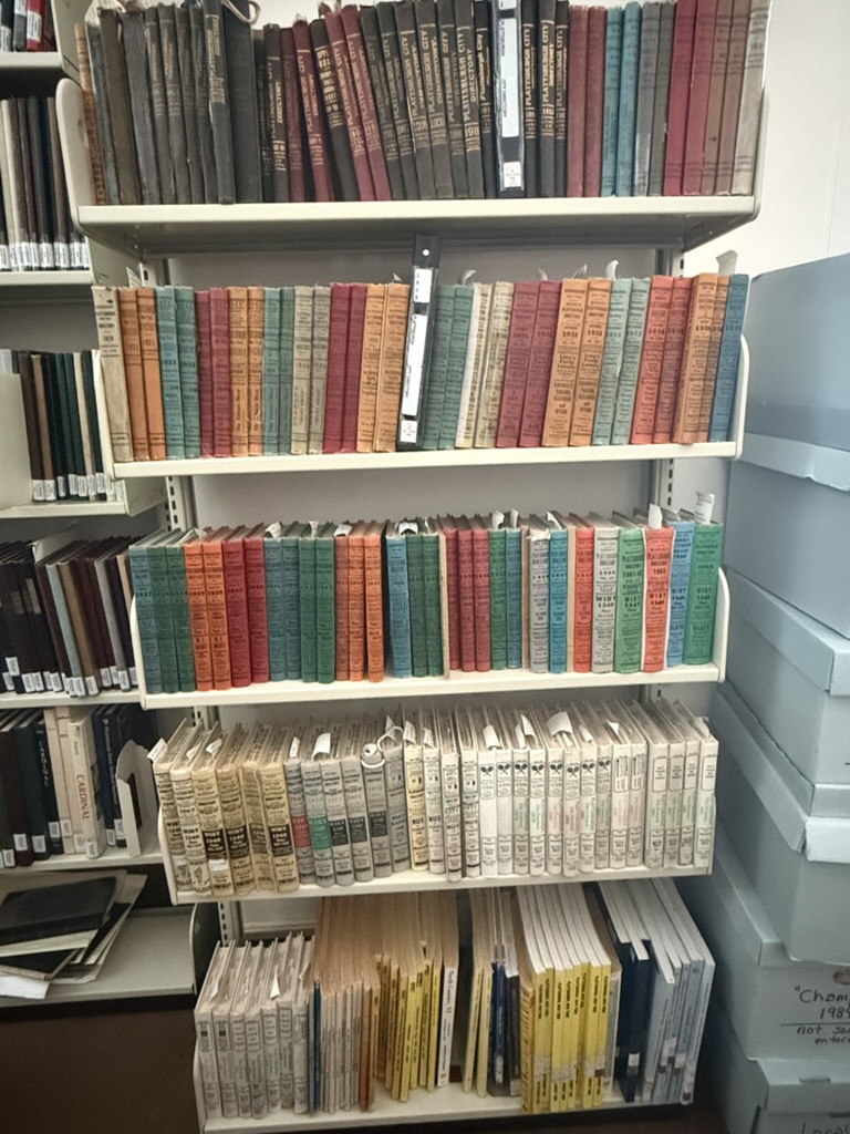 Shelves of colorfully bound city directories